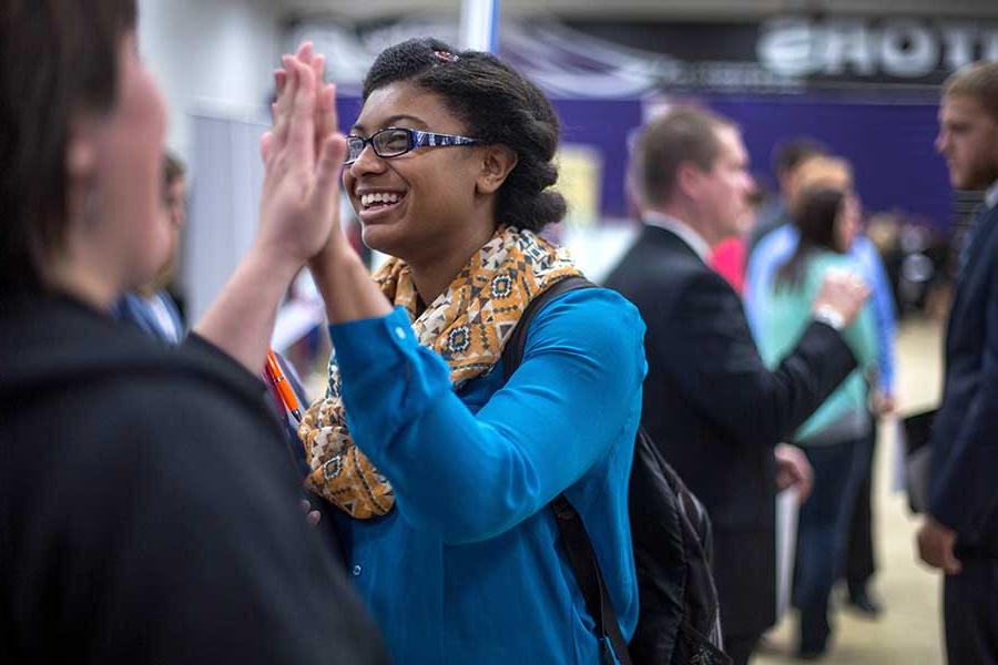 Advertising student high-fiving