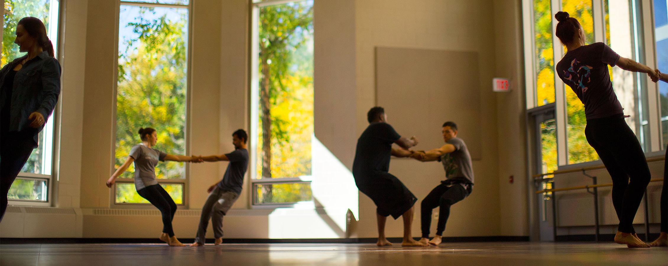 Dance majors at the University of Wisconsin Whitewater learn a new routine in pairs.