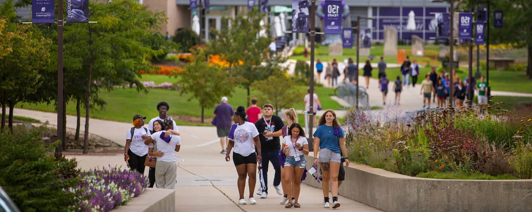 Image of the center of campus at 足彩平台 with students walking down the sidewalks