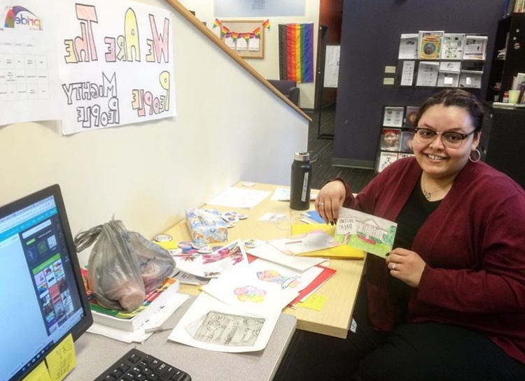 Pride Center Intern working in the office