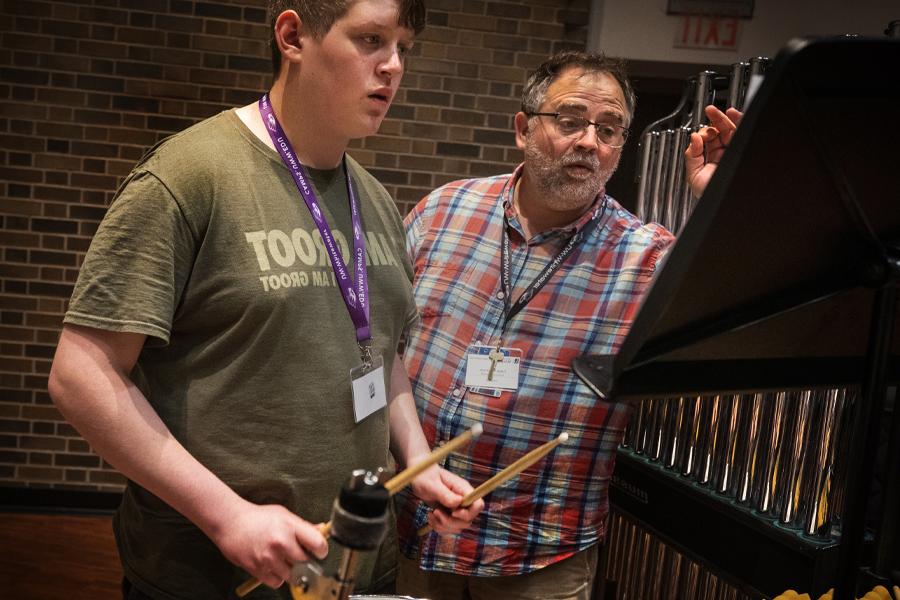 Tobie Wilkinson works with a percussion student.