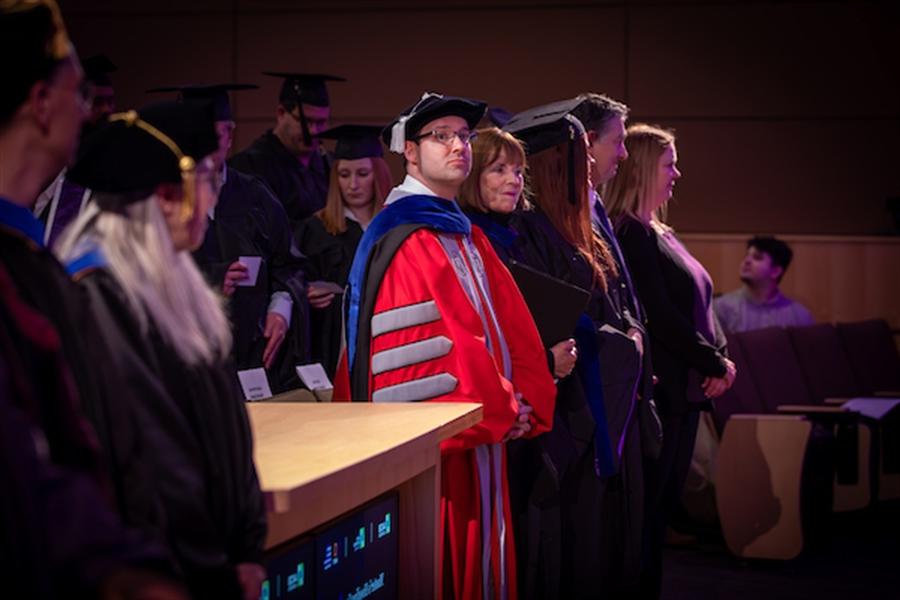 Professor shake hands with DBA student