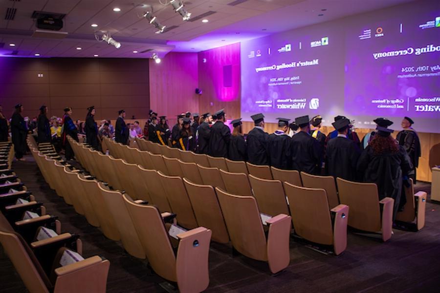 Students in standing to be hooded