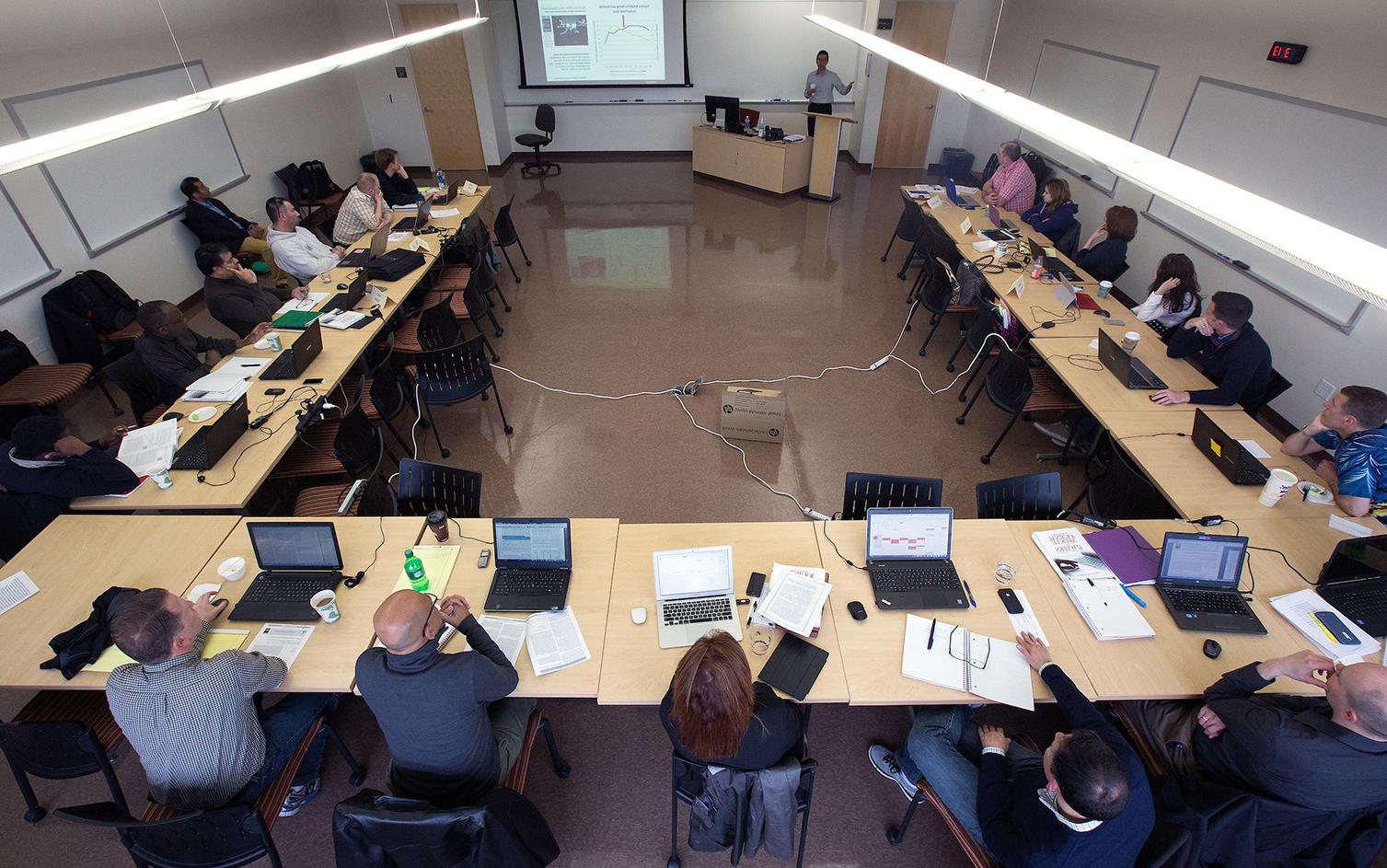 Henry Balani, seated at right with a green binder in front of him, was a member of the first cohort of <a href='http://gqgmge.eric-andre.com'>足彩平台</a>’s DBA program.