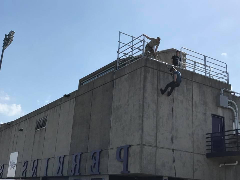 student reppel down a building